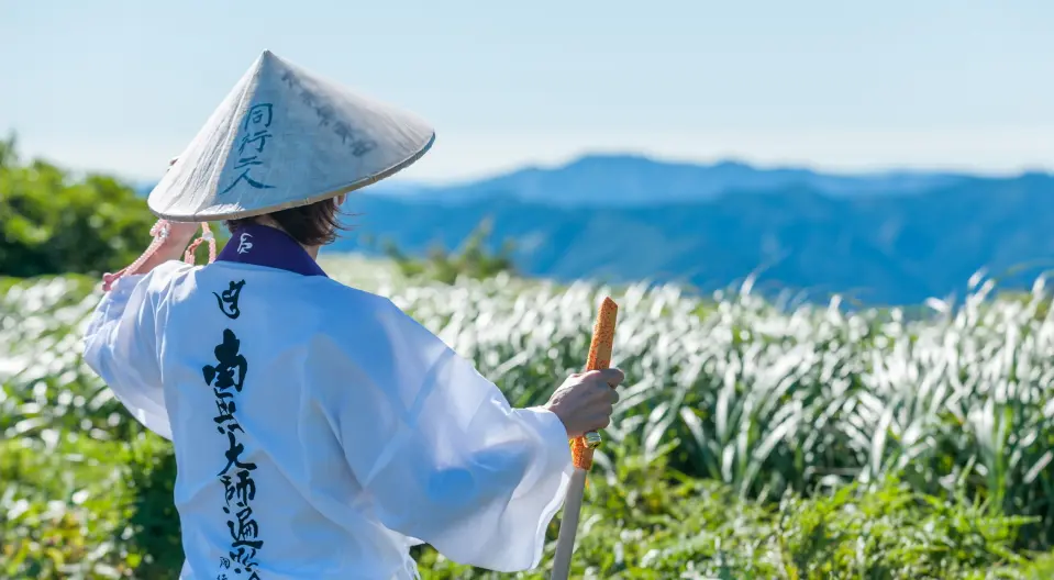 People wearing white coats and looking at the scenery